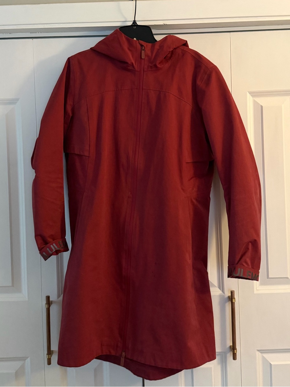 lululemon athletica Women's Hooded Raincoat in Brick Red